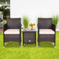 3 Piece Rattan Patio Furniture Set w/ Coffee Table + Beige Cushions.