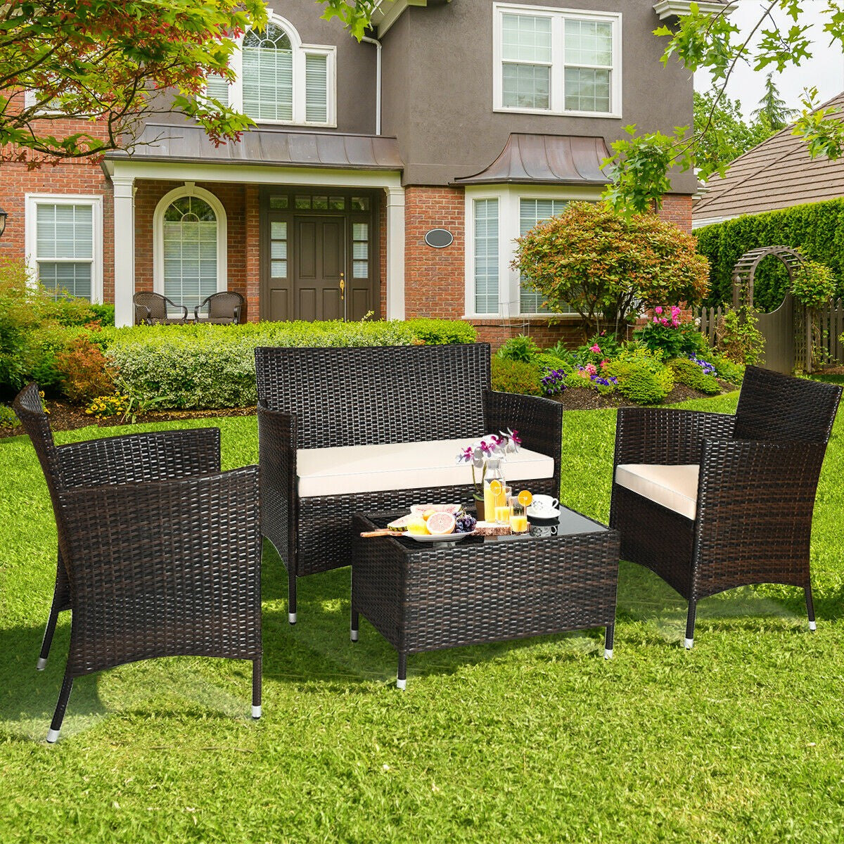 4 Piece Rattan Patio Furniture Set w/ Love Seat + Coffee Table + Red Cushions.